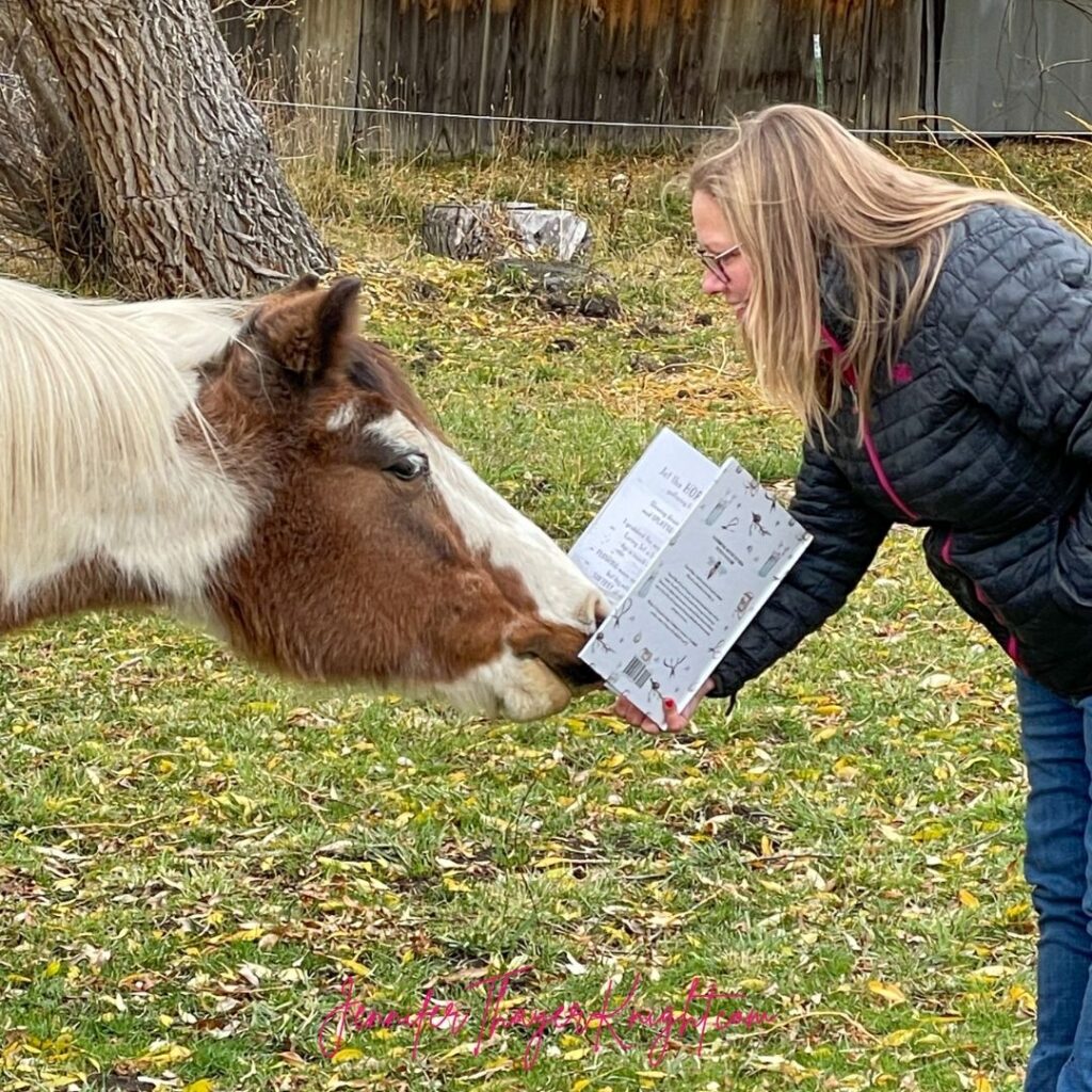Pony Dolly taking a look at the book, "Farm to FIlm."