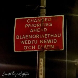 Changed Priorities Ahead - Welsh Road sign