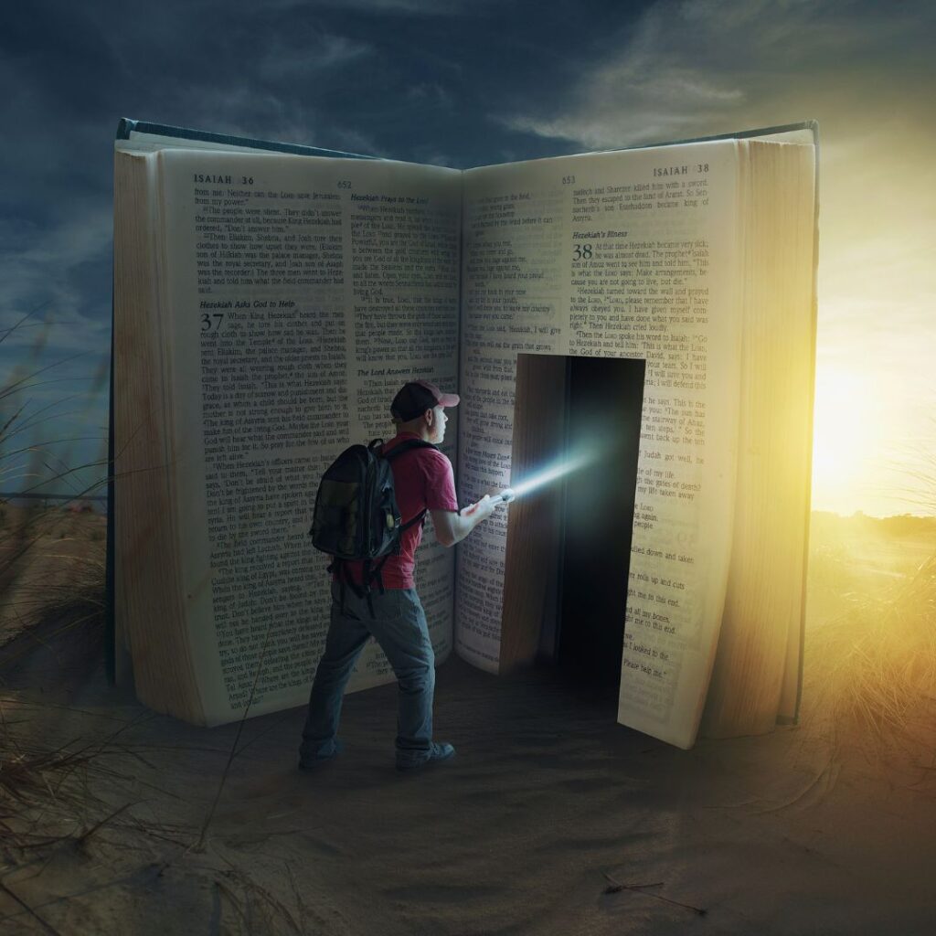 Man with flashlight walking into the Bible